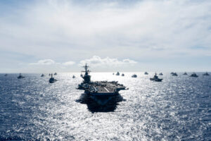 Multinational ships sail in formation during RIMPAC 2024